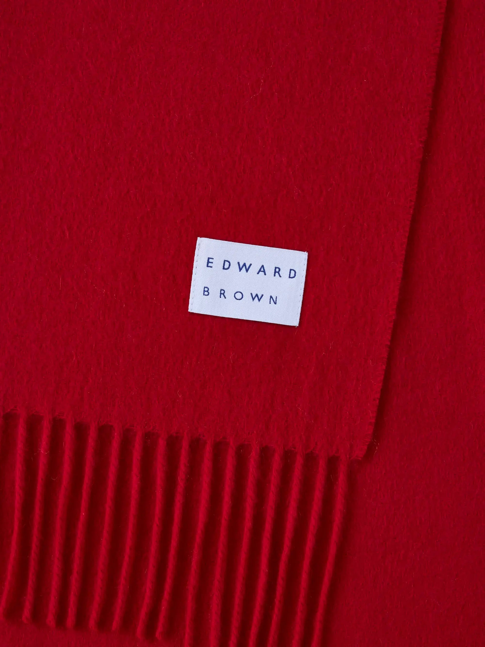 大判カシミヤストール クラシックレッドのEDWARD BROWNロゴタグとフリンジ部分