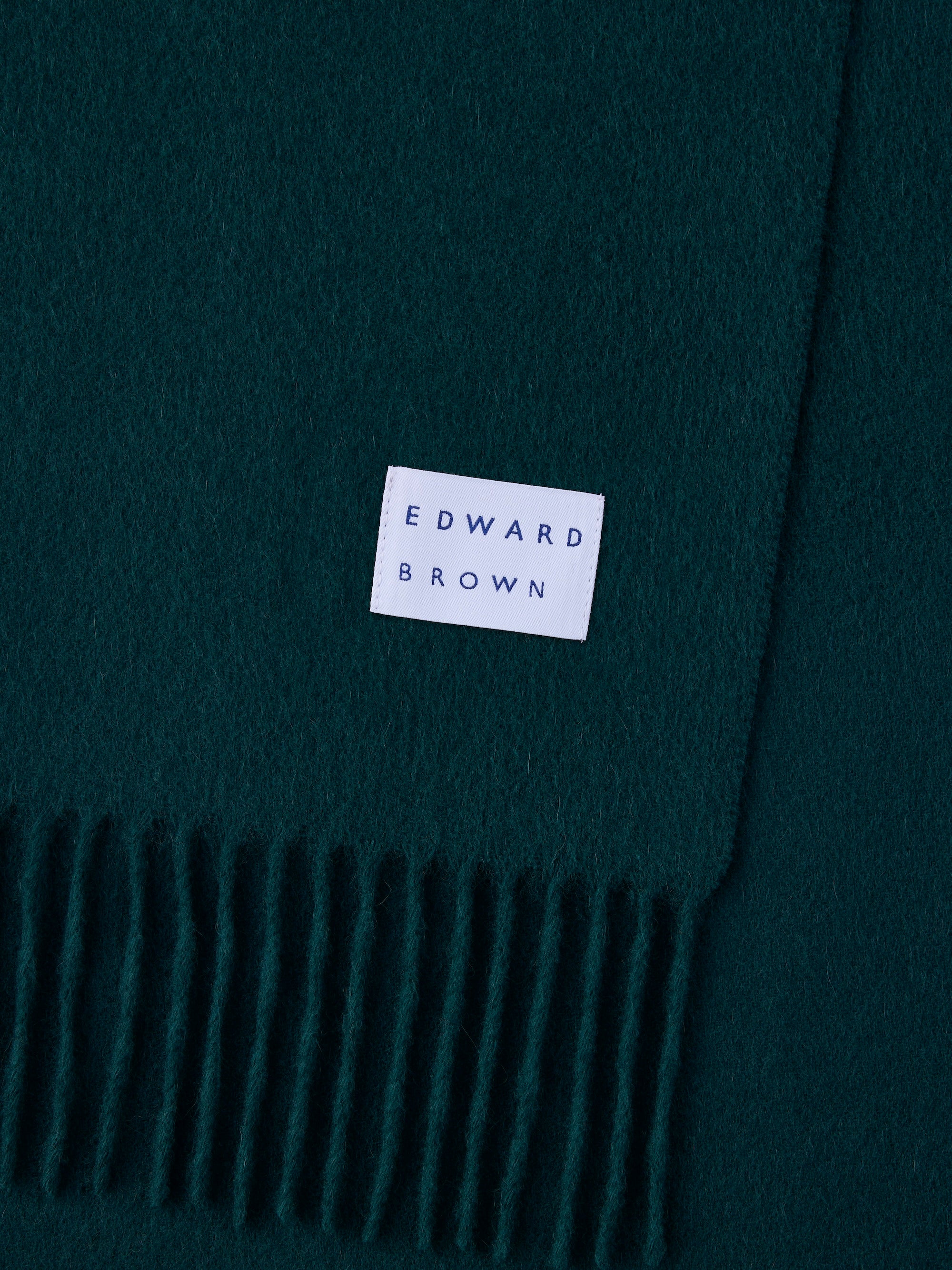 カシミヤマフラー ジュニパーのEDWARD BROWNロゴタグとフリンジ部分